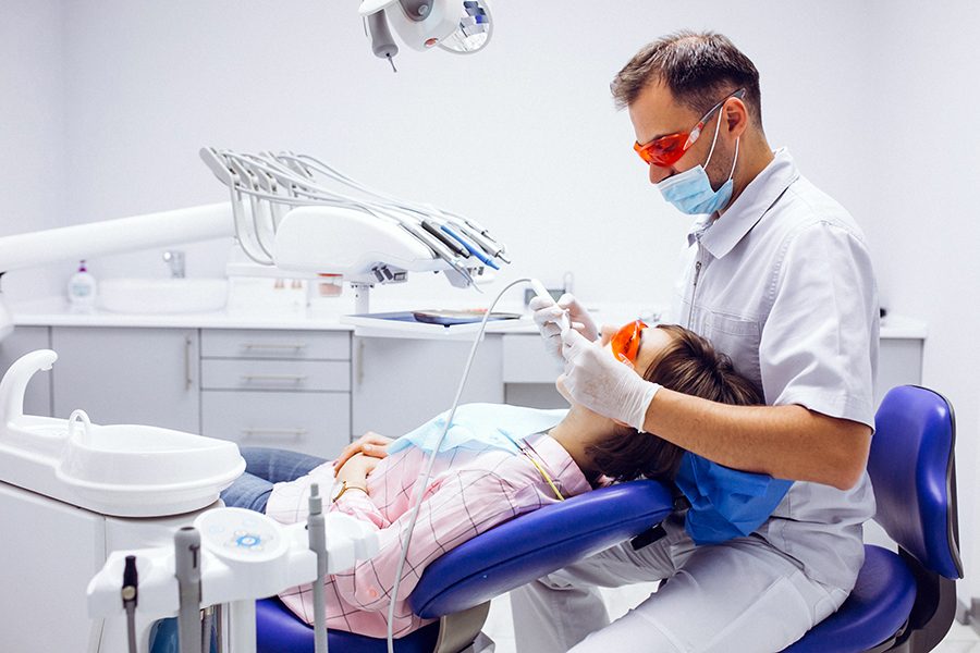 Dentist providing gentle treatment to a patient at Best Dental Clinic